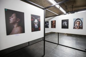 Explore a striking art exhibition featuring diverse portrait photography on display.