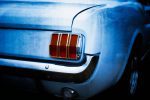 This striking fine‑art automotive print captures the unmistakable rear profile of a late‑1960s Ford Mustang, a true icon of American muscle. Photographed and digitally painted by Charles David