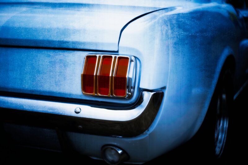This striking fine‑art automotive print captures the unmistakable rear profile of a late‑1960s Ford Mustang, a true icon of American muscle. Photographed and digitally painted by Charles David