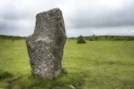 A striking Bodmin Moor scene featuring a single standing stone from the Minions stone circle. A limited edition print by Alex Hamer