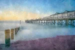 A serene Teignmouth Pier at Dawn belies the history of this impressive monument.. Digitally painted by Alex Hamer