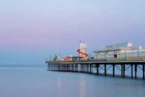 Paignton Pier Blue Hour is a limited edition print from Alex Hamer depicting an enigmatic view of this iconic structure